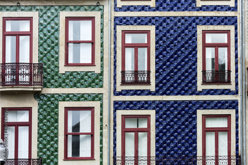Traditional historic facade decorated with azulejos tiles in Porto, Portugal