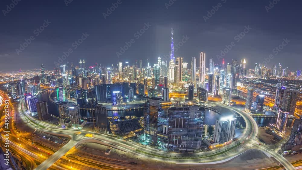 Panoramic skyline of Dubai with business bay and downtown district night timelapse. Panoramic skyline of Dubai with business bay and downtown district night timelapse.