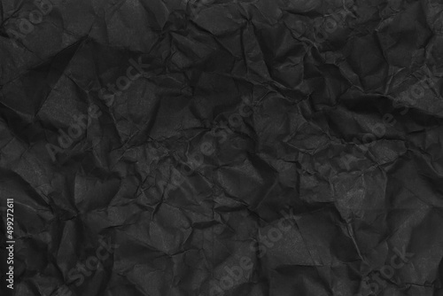 black crumpled paper texture as background