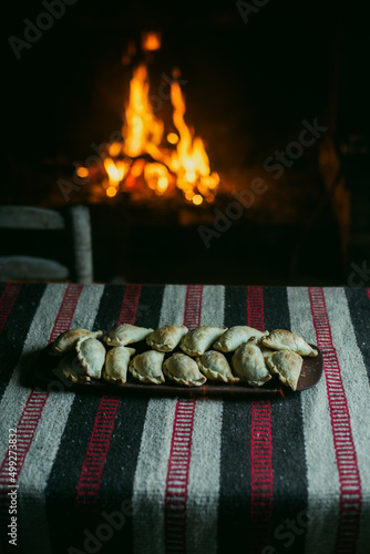 Argentine Empanadas near a fire place