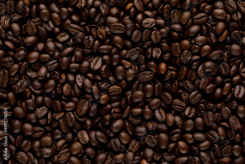 Roasted coffee beans pattern. Abstract background texture photo