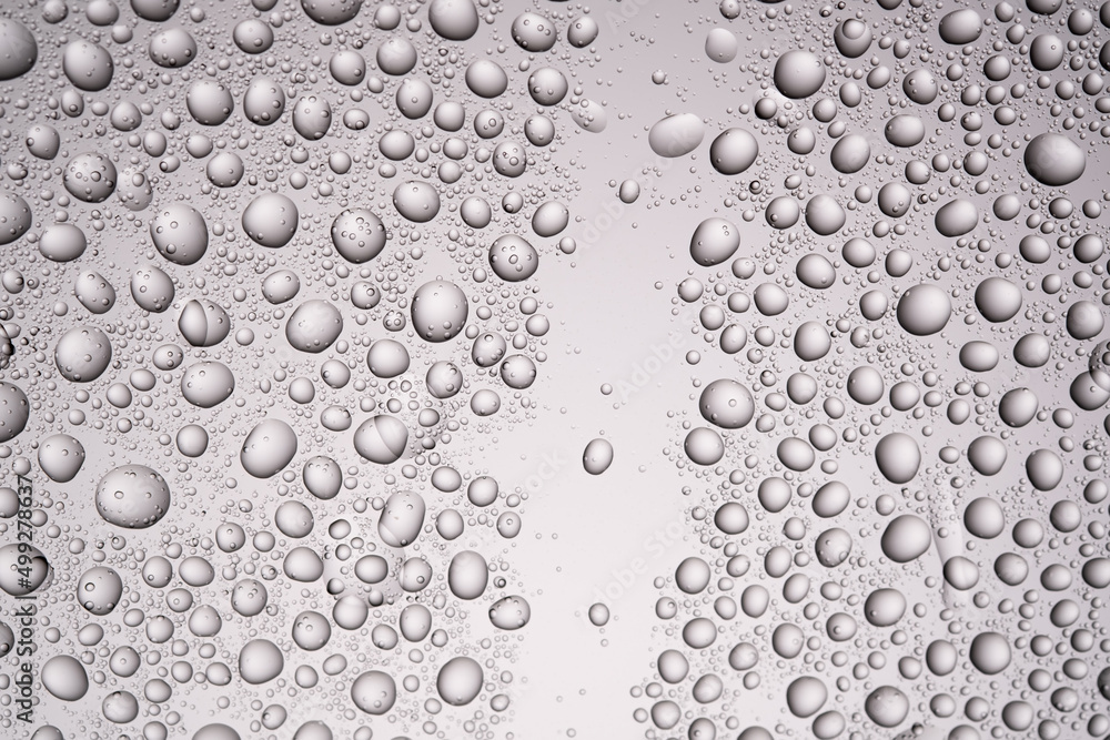 Drops of water on a transparent gray background. Drops of water on a transparent gray background.