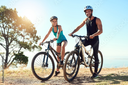 Fototapeta Naklejka Na Ścianę i Meble -  Riding is so much more than just a hobby. Shot of a happy young couple out mountain biking together.