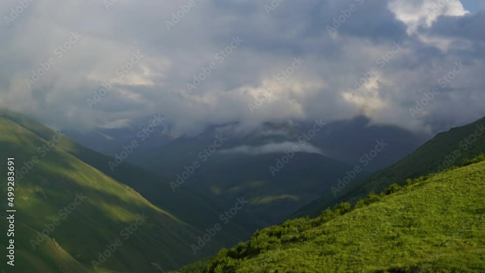 Beautiful landscape with mountains and clouds in dusk, Caucasus, Russia, zoom out timelapse 4k Beautiful landscape with mountains and clouds in dusk, Caucasus, Russia, zoom out timelapse 4k