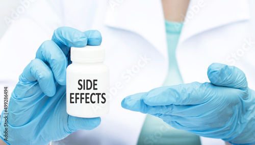 The doctor is holding a jar of text side effects in his hands. medical and healthcare concept