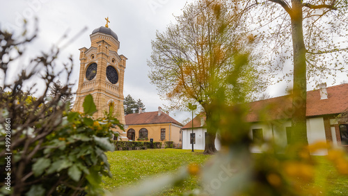 Church Hram trojice in Kragujevac, Serbian city on a cloudy day. Frog view of belltower of orthodox church.