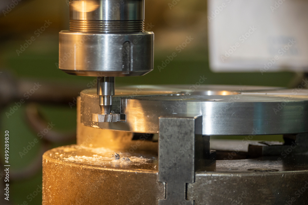 The NC milling machine T-slot cutting the metal parts. The NC milling machine T-slot cutting the metal parts.