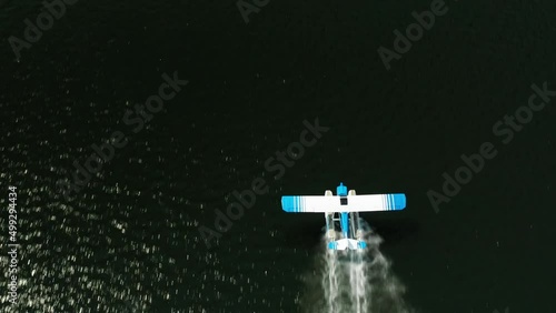 Aerial top down, seaplane taking off from lake water surface. Balsam Lake, Wisconsin