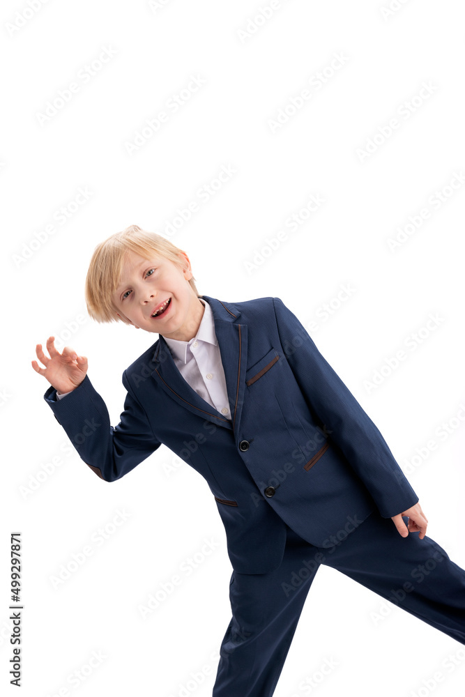 Funny blond boy in school uniform shows the OK gesture. Portrait of schoolboy isolated on white background. Vertical frame. Funny blond boy in school uniform shows the OK gesture. Portrait of schoolboy isolated on white background. Vertical frame.