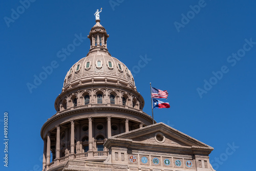 Top part of the Texas State Capitol building is shown. The Texas State Capitol is the capitol and seat of government of the American state of Texas. photo