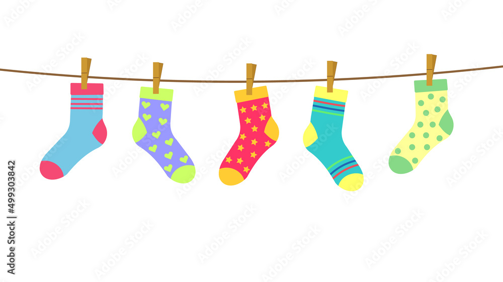 colorful bright socks on a rope with clothespins against a background of sky and clouds. Cute clothes
