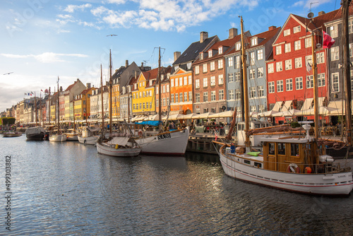 Colorful houses and boats on the embankment of the canal in the Nyhavn © sweethelen