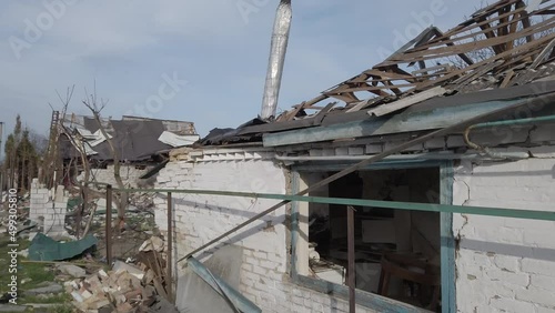 Velyka Dymerka, Kyiv Oblast, Ukraine - April 2022: War Ukraine Russia. Ruins of a house after being bombed by the Russian army. Destroyed house after a missile strike. photo