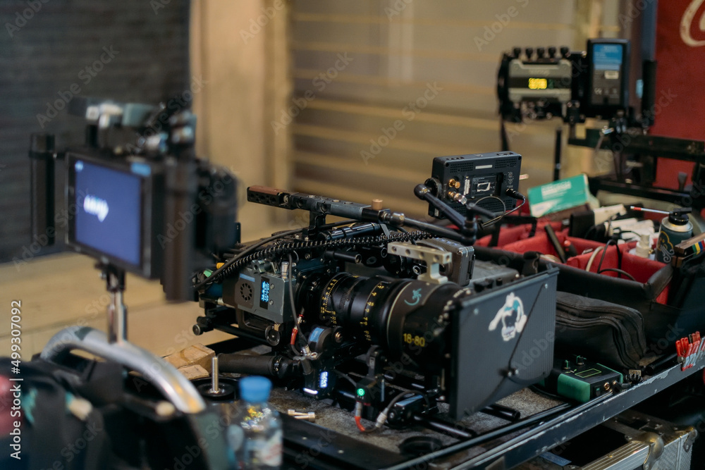 A professional film and video camera on the set. Filming day, equipment and crew. Technique of modern video filming. A professional film and video camera on the set. Filming day, equipment and crew. Technique of modern video filming.