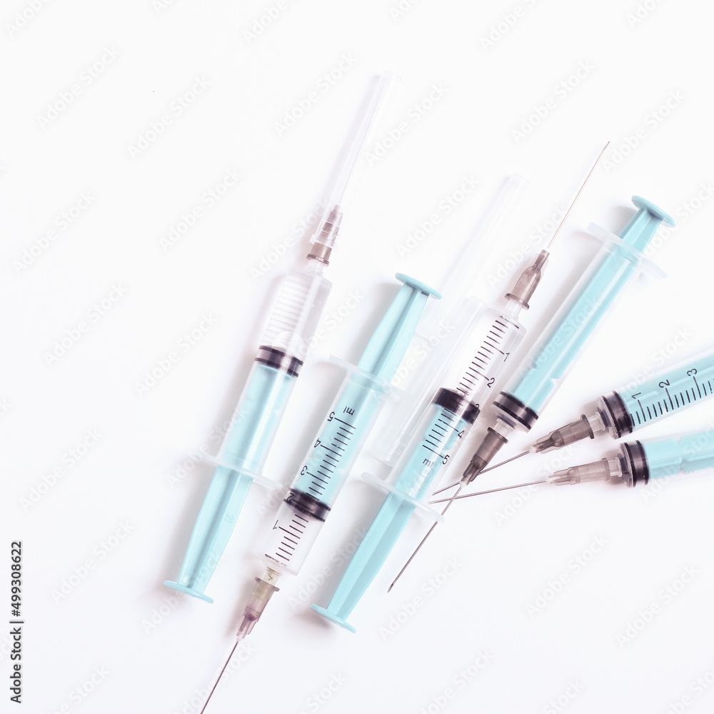 Medical syringe on a white background. A syringe for injection. The concept of health and beauty Medical syringe on a white background. A syringe for injection. The concept of health and beauty