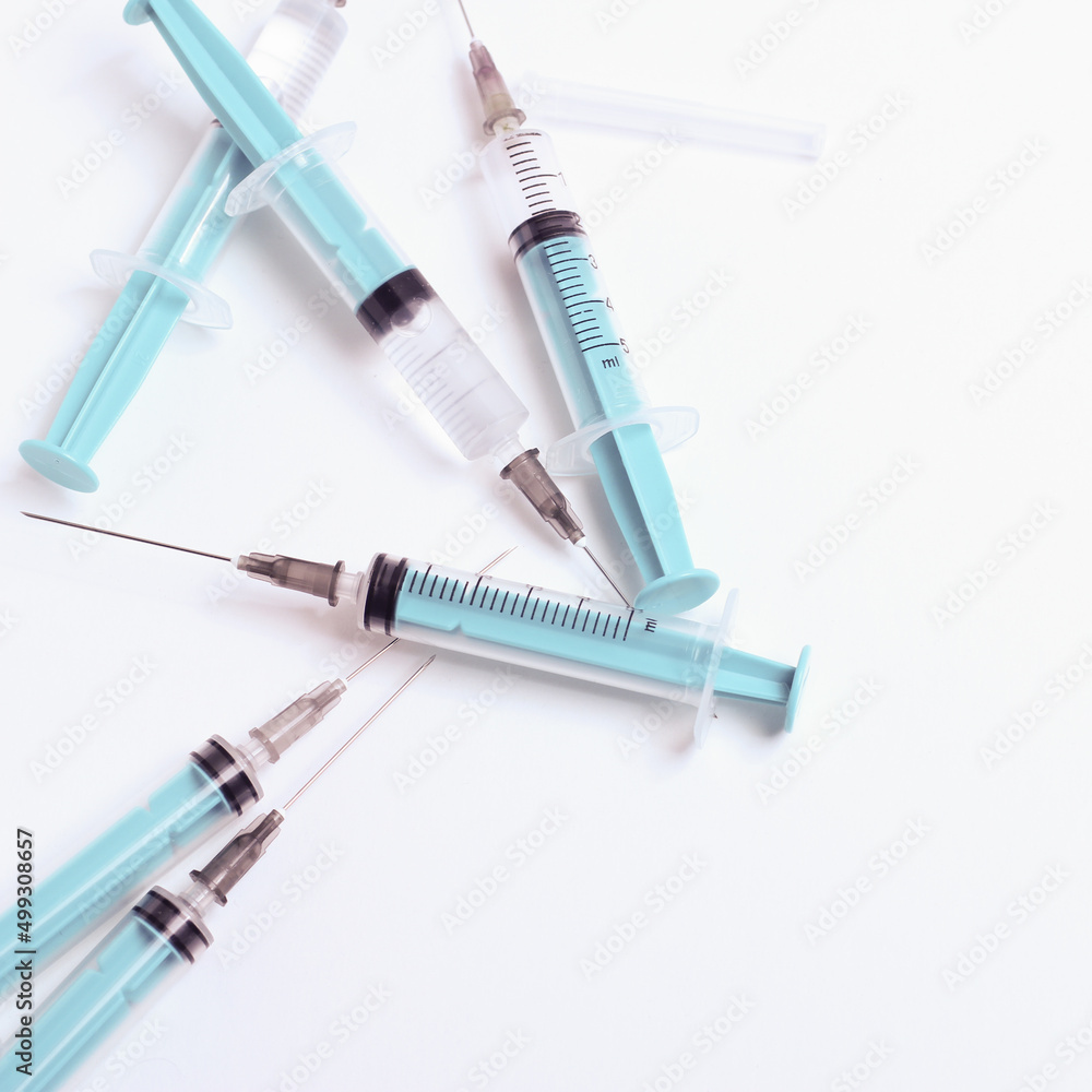 Medical syringe on a white background. A syringe for injection. The concept of health and beauty Medical syringe on a white background. A syringe for injection. The concept of health and beauty