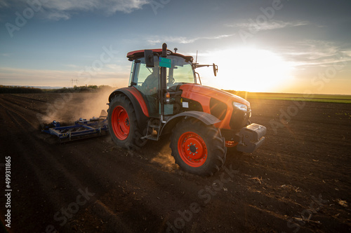 Fototapeta Naklejka Na Ścianę i Meble -  Tractor working in the field