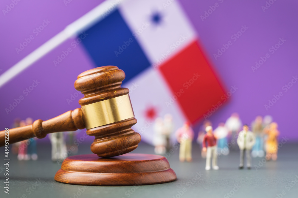Judge gavel with blurred Panama flag and plastic toy men background, Panama society litigation concept