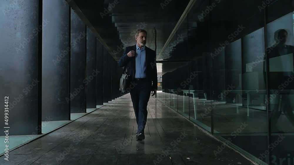 Handsome senior business man working moments. Expert sales person going to work in the morning Handsome senior business man working moments. Expert sales person going to work in the morning