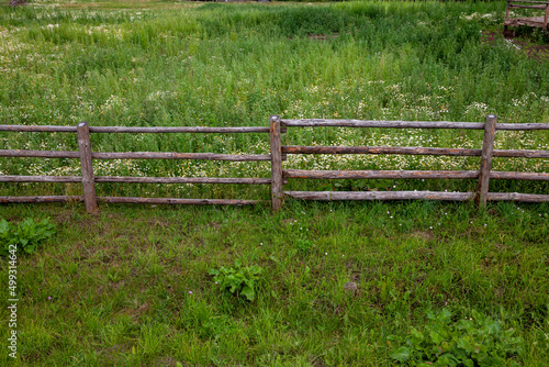 part of a wooden fence for livestock in the village