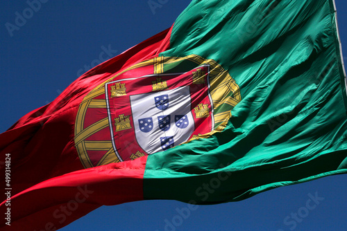 closeup flag of portugal in blue sky