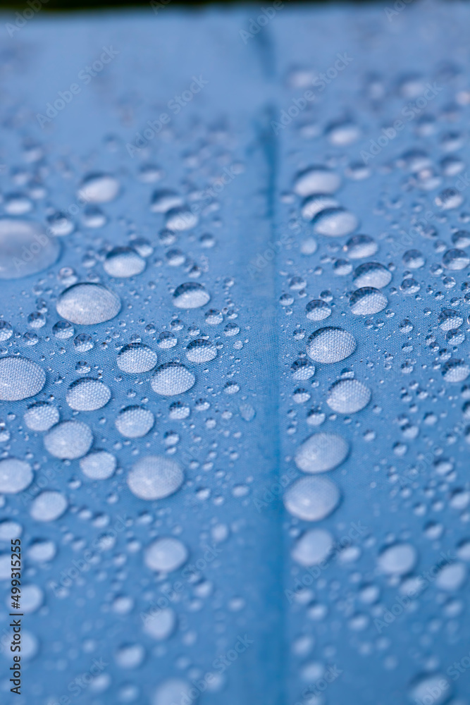 multi-colored umbrella with water drops multi-colored umbrella with water drops