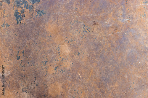 Brown color rustic metal sheet with scratches and spots © Xookits