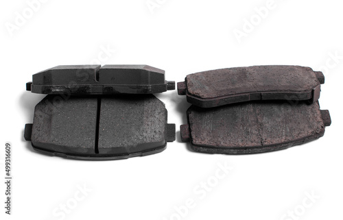 Set of brake pad. Comparison of new and old pads. Spare parts for car isolated on white background