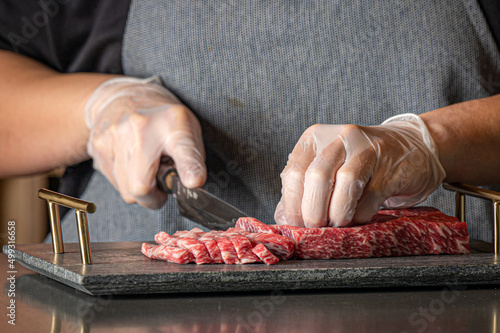 Close up of chef slicing Wagyu beef