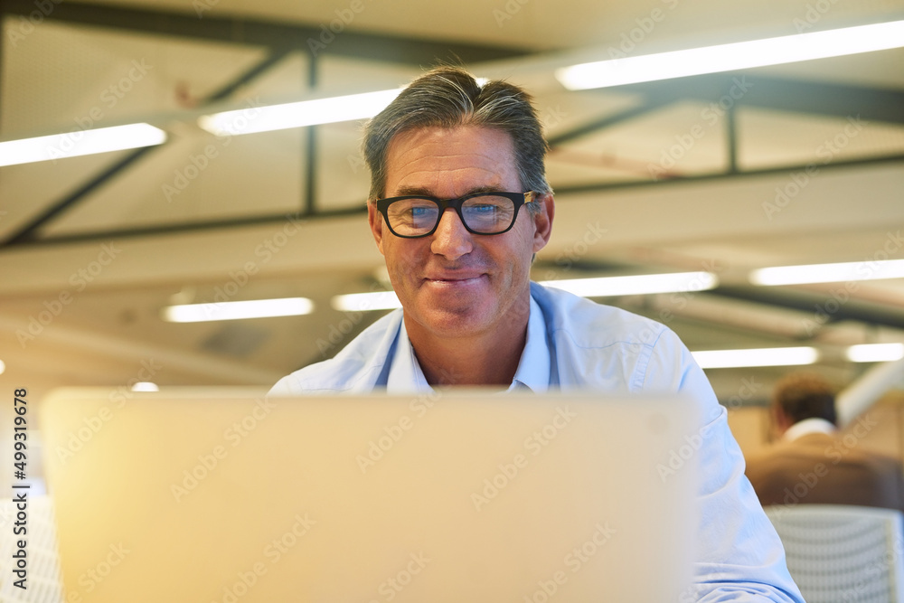 Another positive review from a client. Shot of a hardworking businessman using his laptop at his desk in the office. Another positive review from a client. Shot of a hardworking businessman using his laptop at his desk in the office.