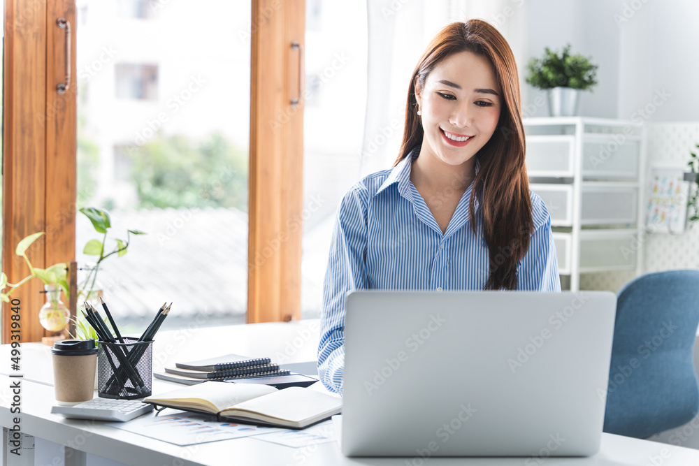 girl working at office on desk with computer graph work concept. beautiful smile girl working at office on desk with computer graph work concept. beautiful smile