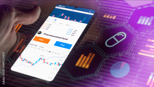 Exchange-traded fund etf pharma chart, stock market data on smartphone. Business analysis of a trend. Invest in international shares ETF. Buying strategic pahrmaceutical shares.