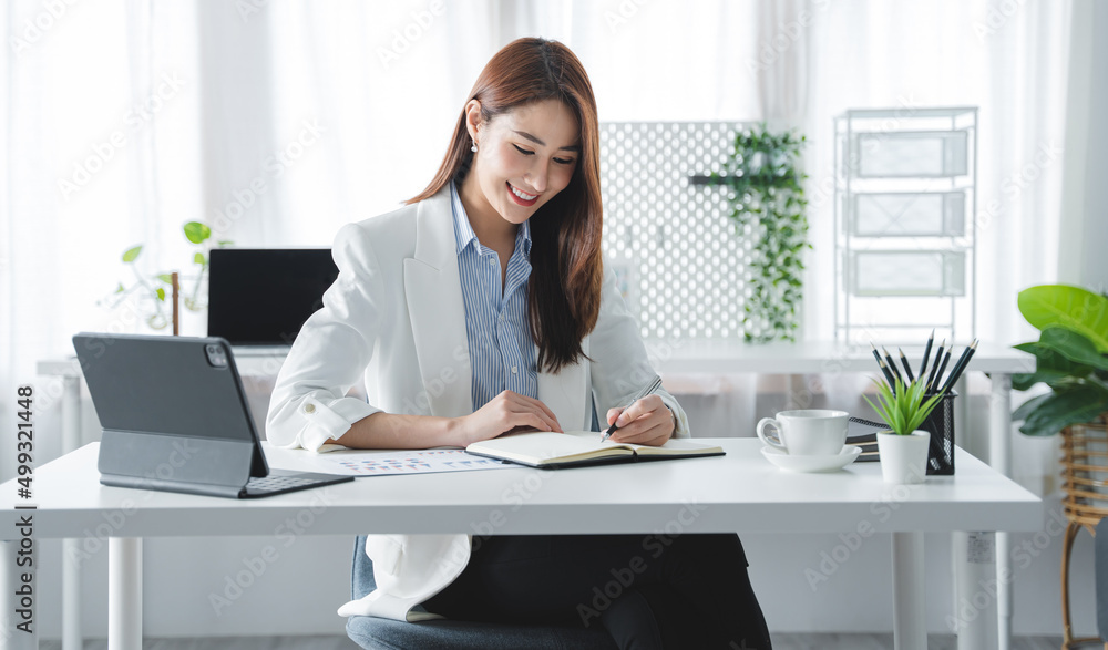 girl working at office on desk with computer graph work concept. beautiful smile girl working at office on desk with computer graph work concept. beautiful smile
