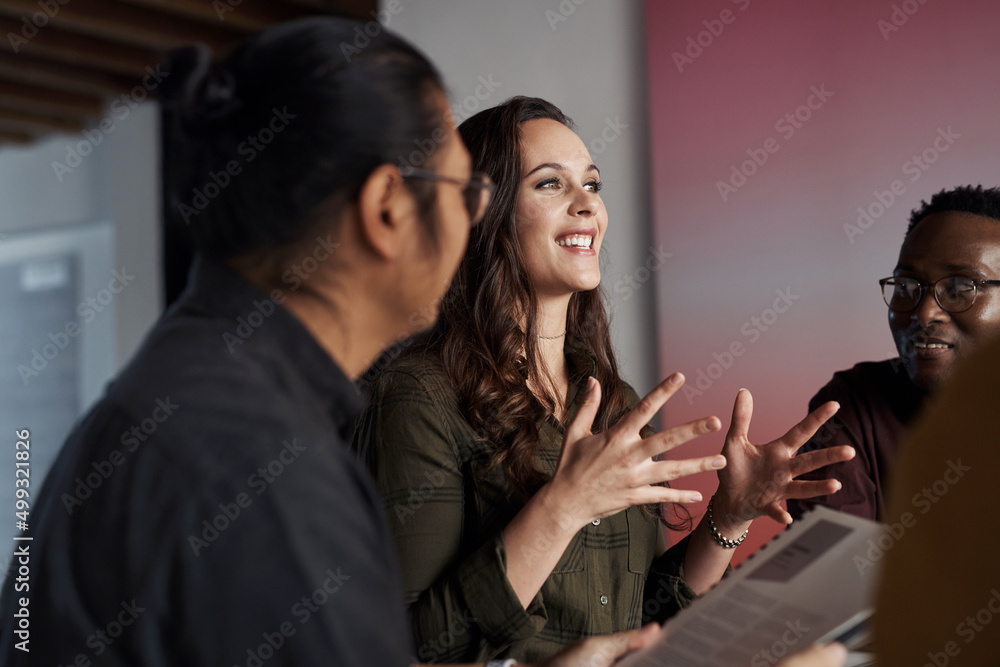 In a successful business, everyones opinions matter. Cropped shot of a group of young businesspeople sitting and having a meeting in the office. In a successful business, everyones opinions matter. Cropped shot of a group of young businesspeople sitting and having a meeting in the office.