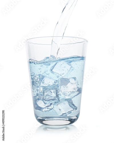 glass with water and ice on a white isolated background