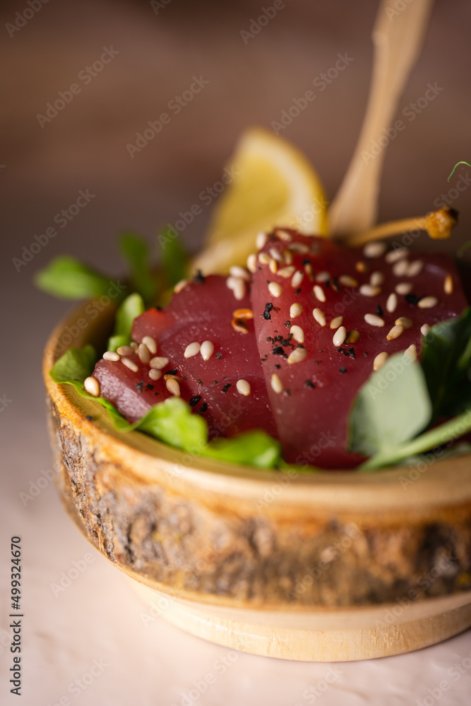 tuna sliced bruschetta with sesame seeds close-up