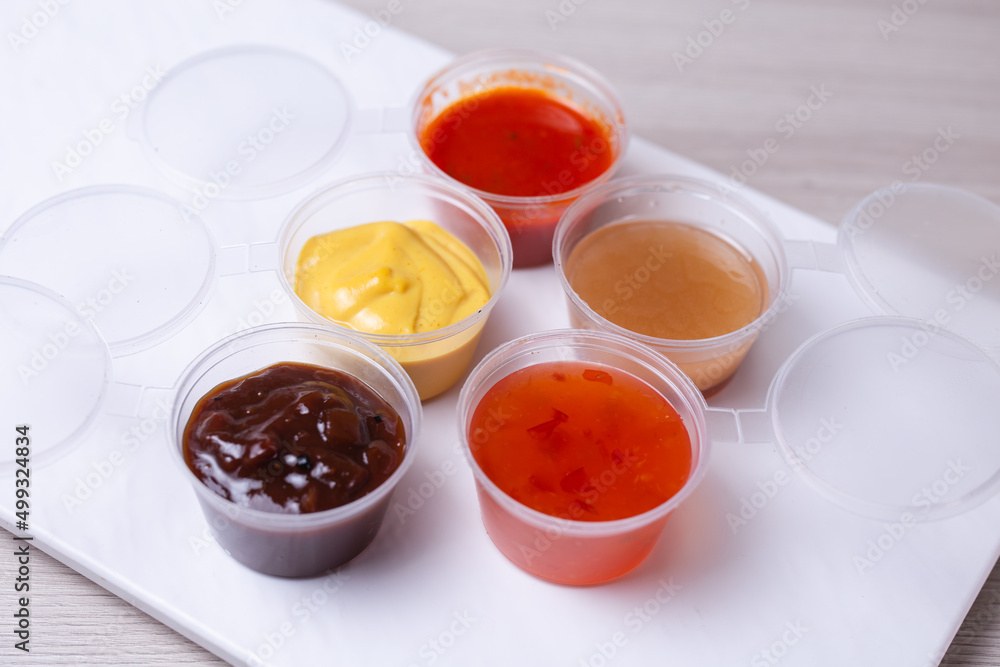 sauce for delivery in a saucepan on a white background sauce for delivery in a saucepan on a white background
