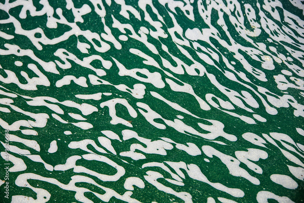 Interesting color pattern on top of water in a pond Interesting color pattern on top of water in a pond