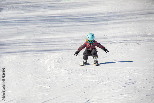 Little girl learning to ski on a ski slope