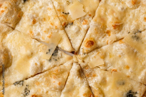 Four cheese pizza quattro formaggi close up photo.