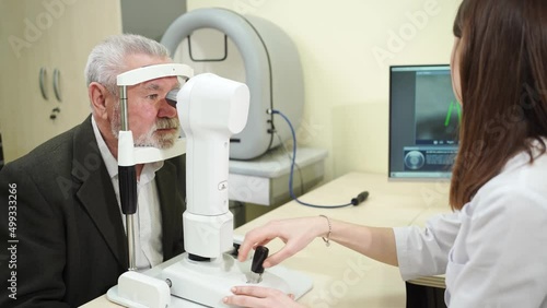 ophthalmologist examination of elderly man on corneo topographer.modern clinic photo