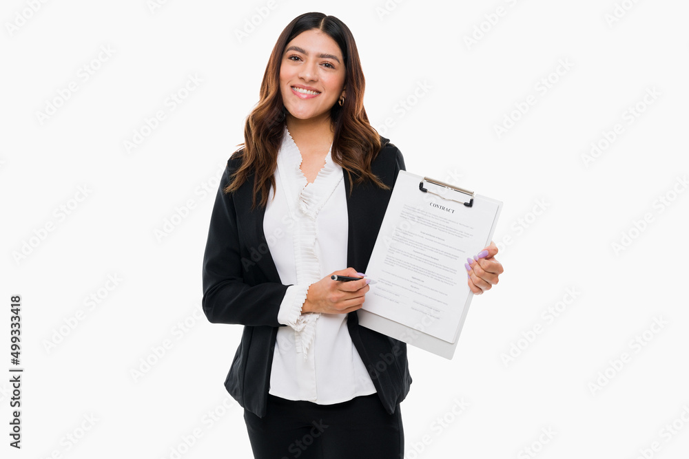 Happy professional woman signing a new contract Happy professional woman signing a new contract