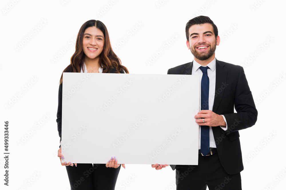 Sales representatives with a blank sign Sales representatives with a blank sign
