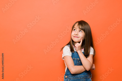Cute little girl having some good ideas