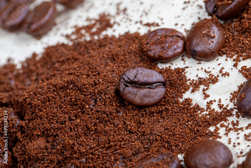 roasted coffee beans and a bunch of ground natural coffee