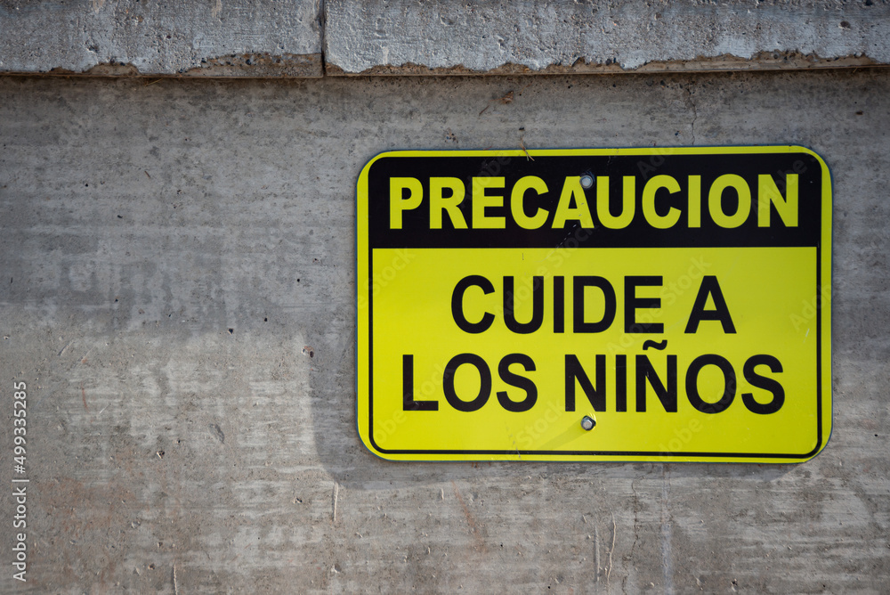 Signage: Caution. Take care of the children. Signage: Caution. Take care of the children.