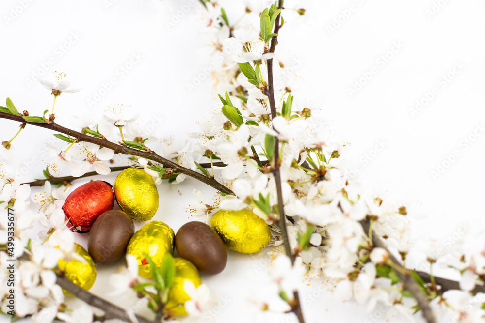 white flower and chocolate easter eggs white flower and chocolate easter eggs