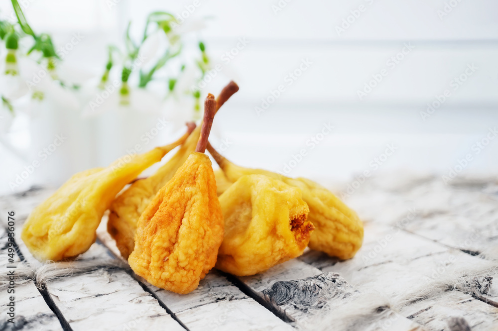 Dried pear on the table. Preservation of fruits by drying. Dried pears snacks are ready to eat. copy space Dried pear on the table. Preservation of fruits by drying. Dried pears snacks are ready to eat. copy space