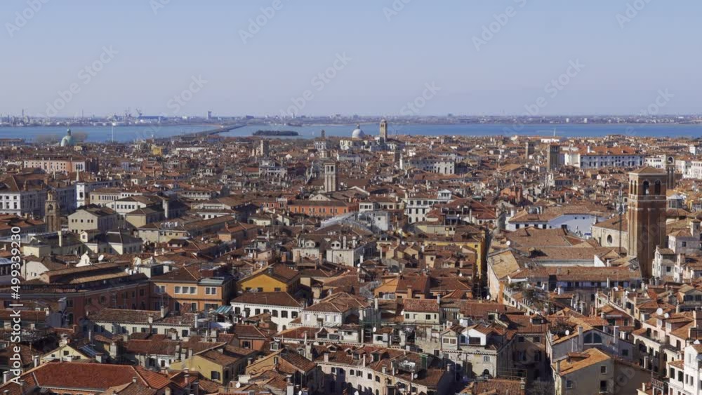 Venice Italy elevated day view panorama with traditional low-rise red tile roof buildings visible from St Marks Campanile. Venice Italy elevated day view panorama with traditional low-rise red tile roof buildings visible from St Marks Campanile.
