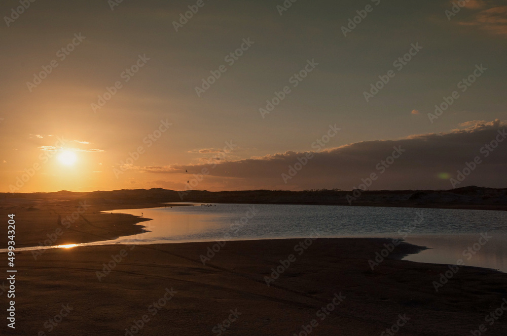 sunset on the beach in praia do cassino